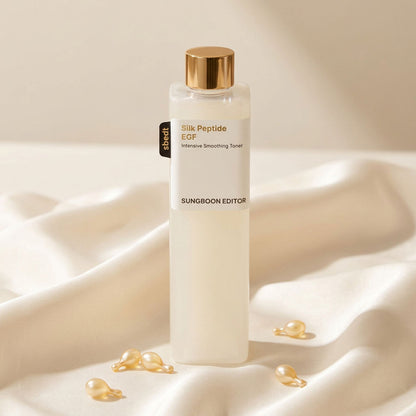 Silk Peptide EGF Toner bottle on silk with golden ceramide capsules
